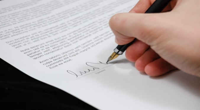 businessman-signing-legal-contract.jpg